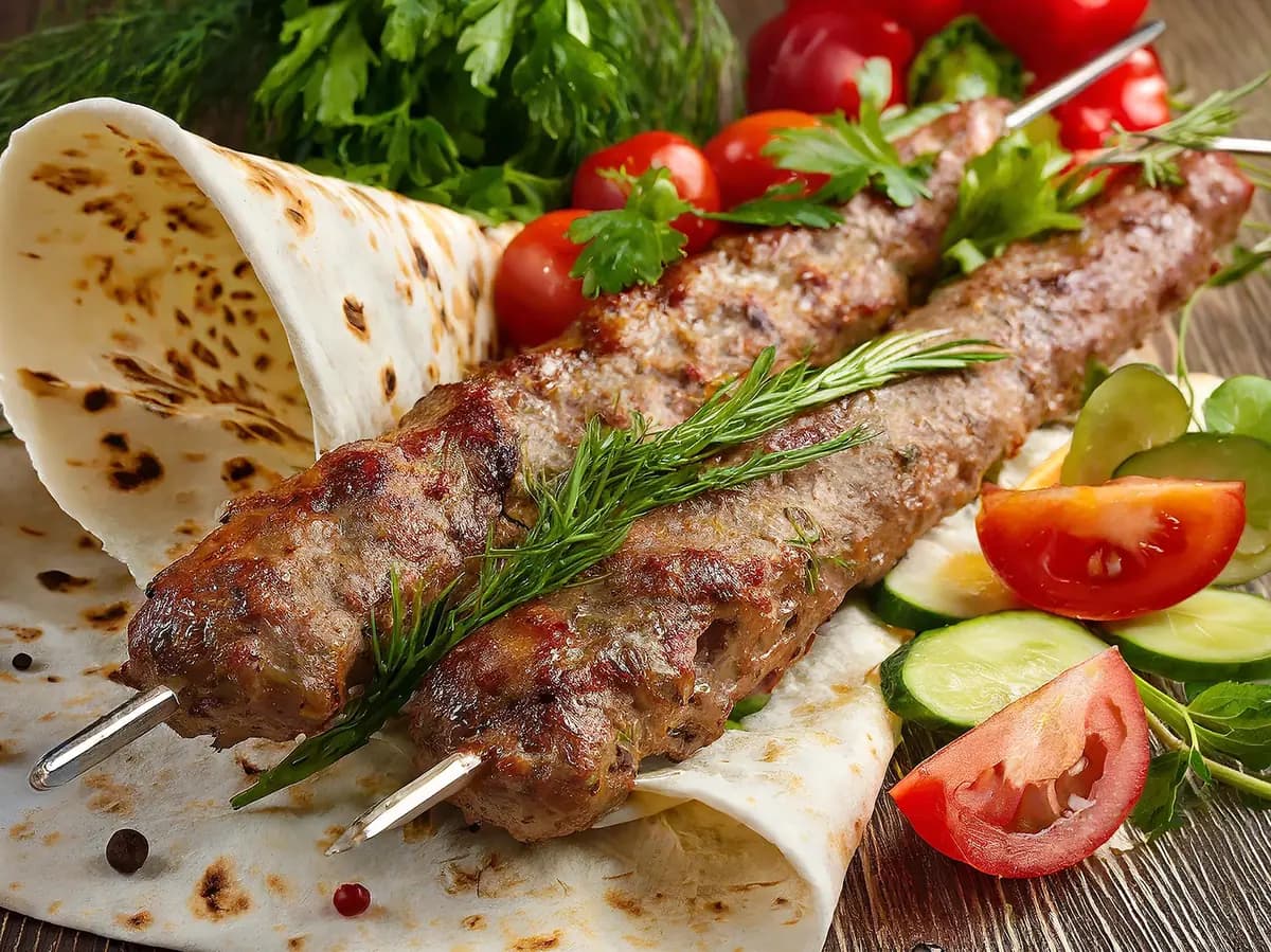 Adana Kebab with bell pepper, bread and chili pepper — Turkey recipe